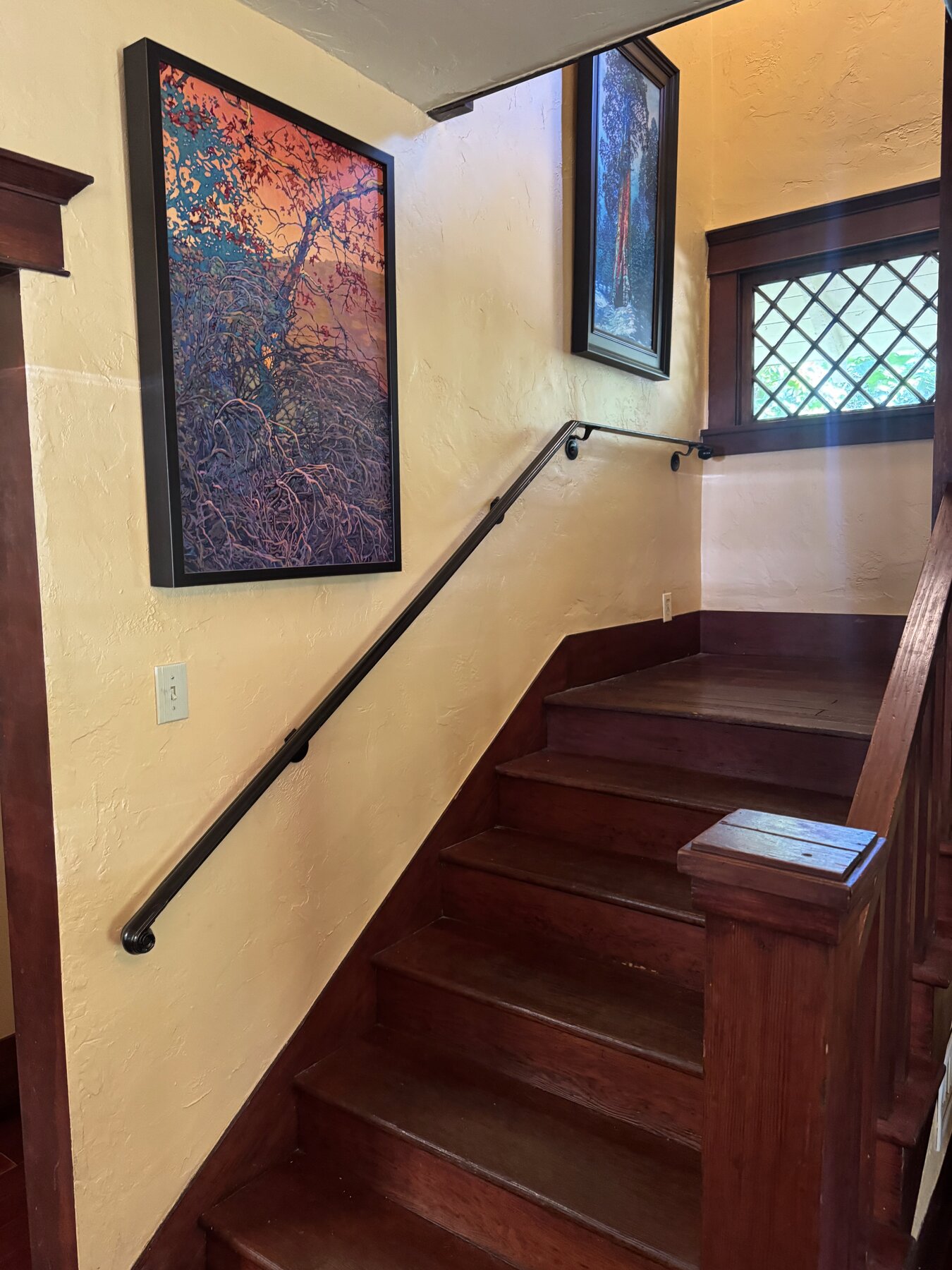 Custom black iron interior staircase handrail installed in Orange County